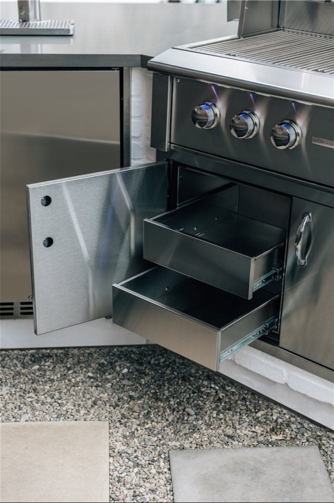 36-inch built-in outdoor gas grill with dual stainless steel slide-out storage drawers and illuminated control knobs