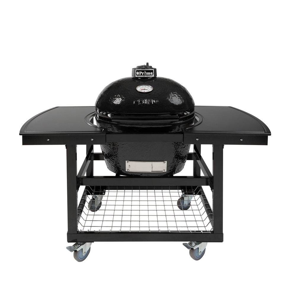 Primo black ceramic kamado charcoal grill on wheeled steel cart with fold-down side shelves and lower wire storage rack — backyard smoker and grill, Vine & Flame