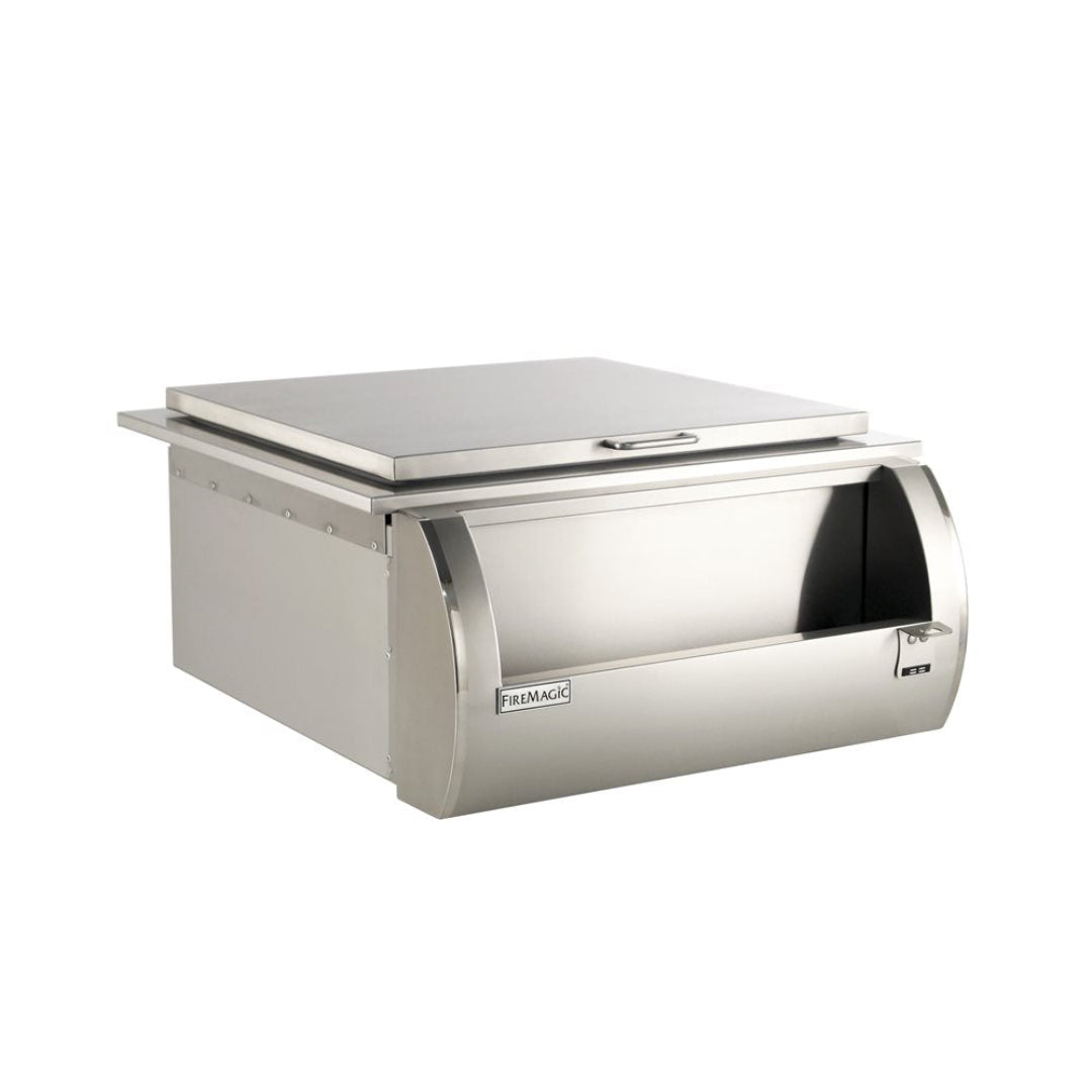 Fire Magic stainless steel built-in access door and storage drawer with hinged top lid and locking curved front for outdoor kitchen grill island