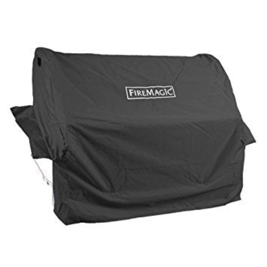 FireMagic black heavy-duty weather-resistant outdoor grill cover with FireMagic logo, protective BBQ cover for FireMagic gas grills and patio barbecues