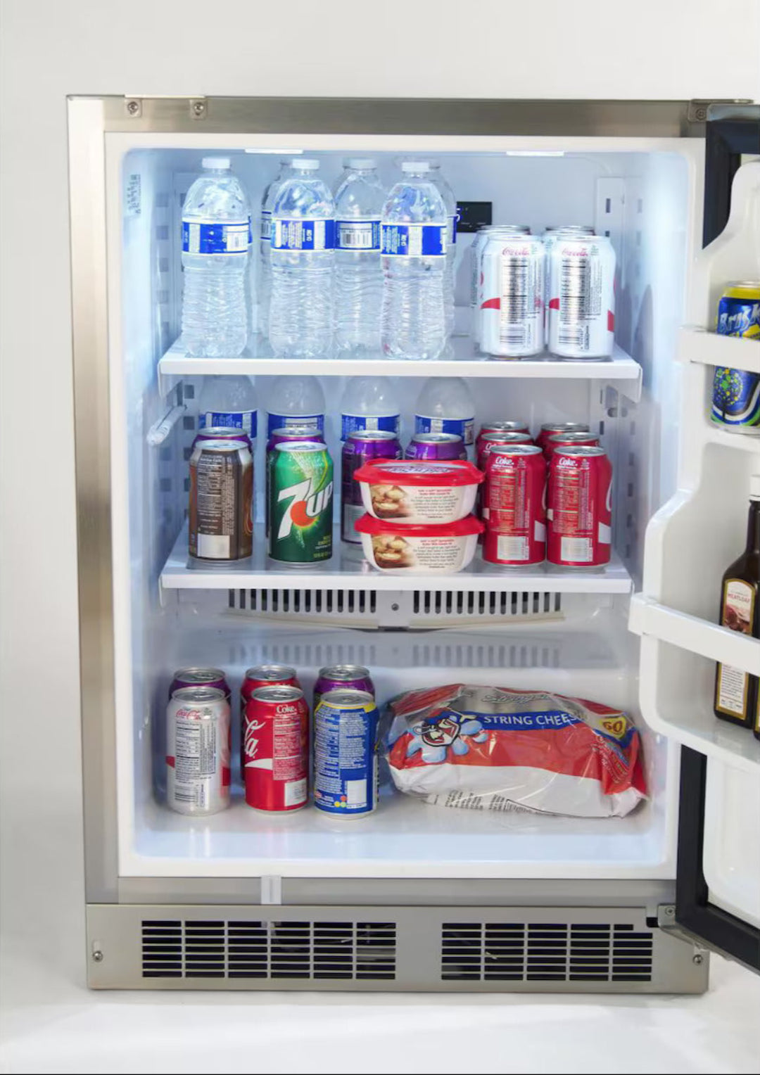 Trueflame 35890DL built-in undercounter stainless steel beverage refrigerator with front venting, LED-lit interior and adjustable shelves, stocked with bottled water and soda cans