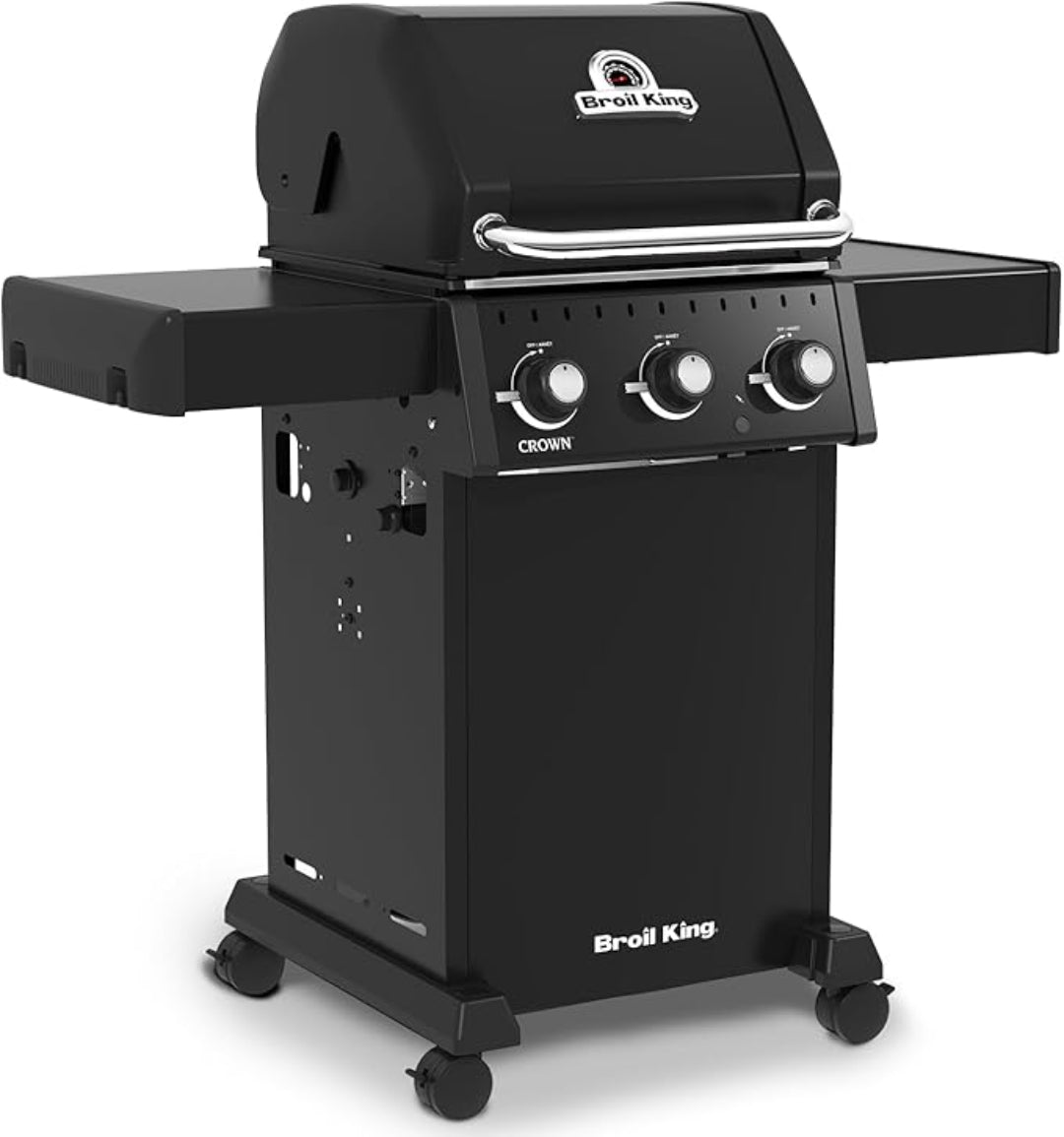 Freestanding grill, Broil King, Crown series, 3-burner propane gas model with closed lid and foldable side shelves.