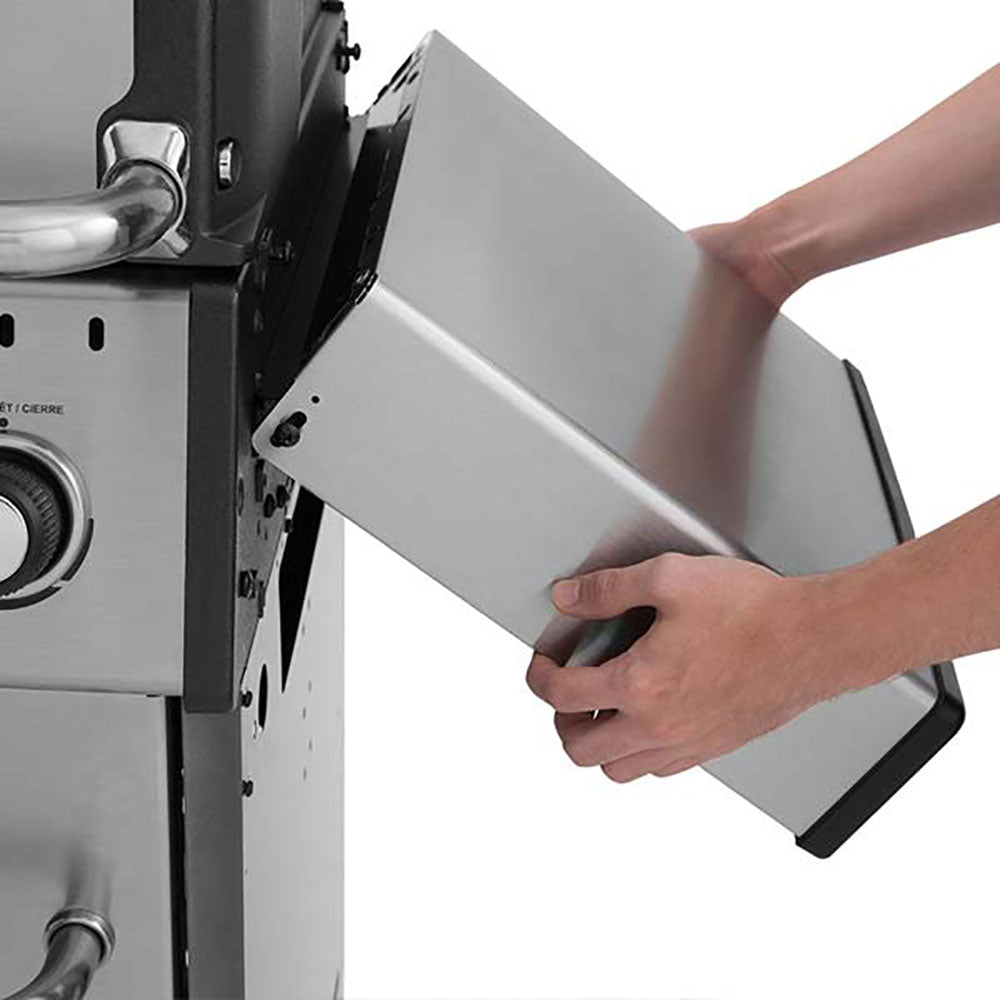 Side shelf removal, Broil King, Baron Series, stainless steel foldable shelf being detached from grill