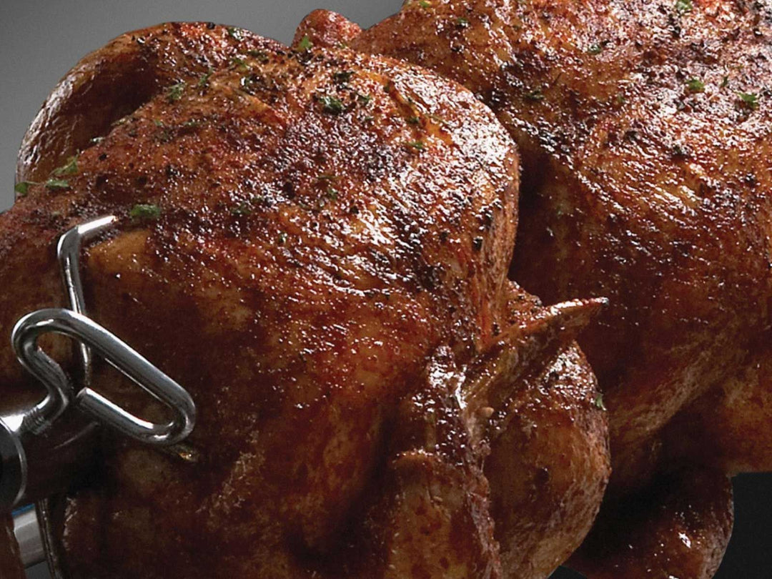 Rotisserie chicken, Broil King Regal, on spit rod, slow-roasting with crispy seasoned skin