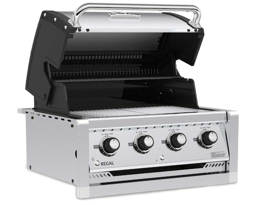 Broil King Regal built-in 4-burner stainless steel gas grill with lid open, angled side view showing dual-level grates and control knobs
