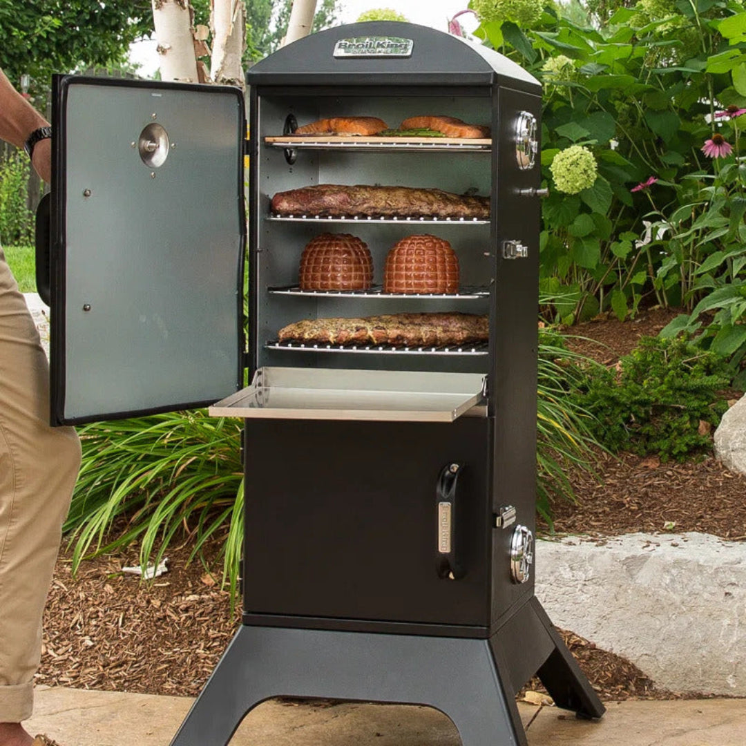 Vertical smoker, Broil King, Smoke Series, outdoor charcoal smoker with open door and loaded food racks