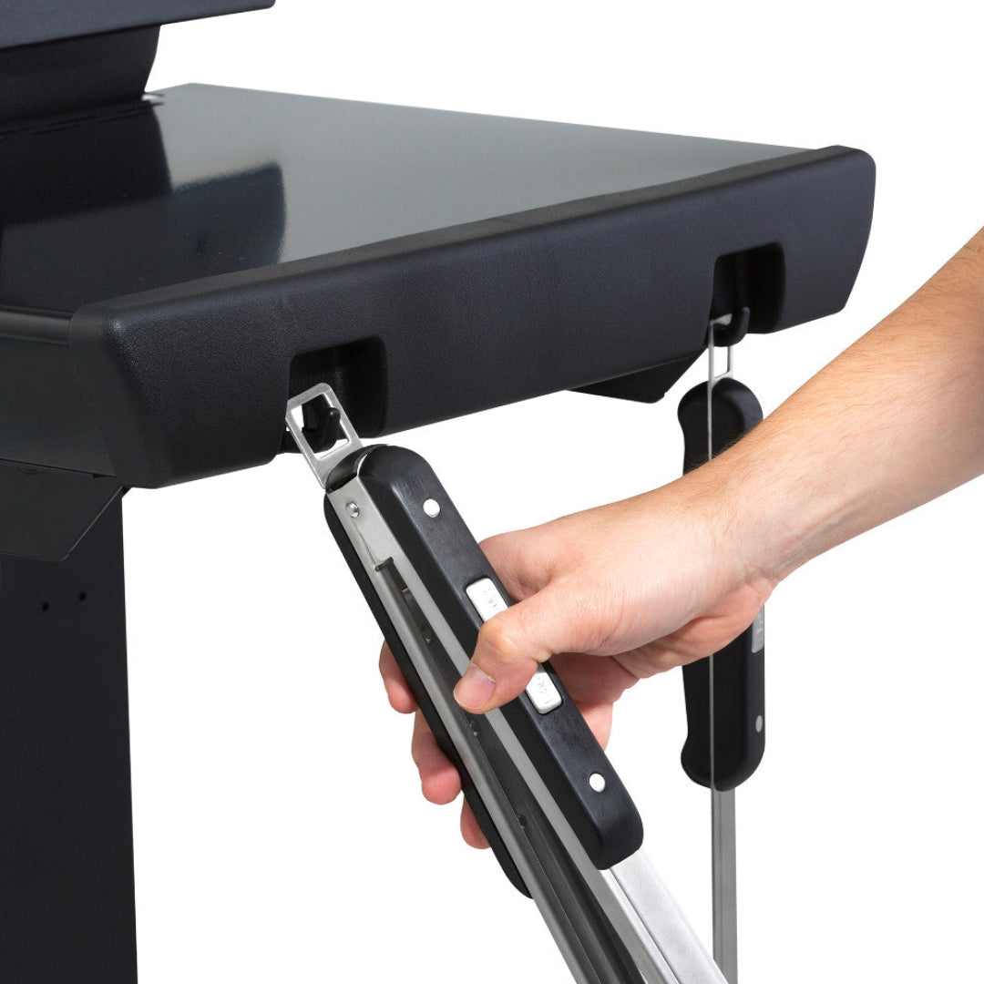 Tool hooks, Broil King Signet, side shelf with integrated utensil hangers holding stainless steel grill tongs and fork