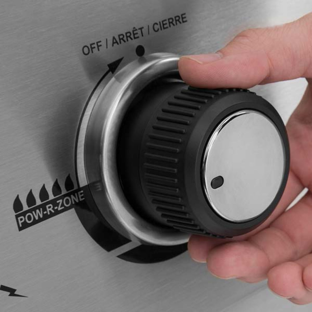 Control knob, Broil King, black plastic and stainless steel, Pow-R-Zone ignition control, hand adjusting knob, stainless steel panel background