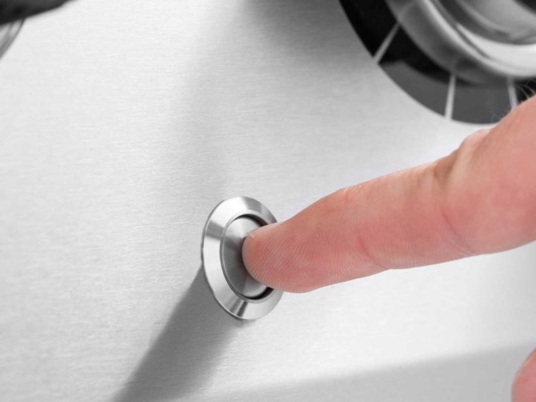 Broil King push-button ignition for fast and reliable startup on stainless steel gas grill.