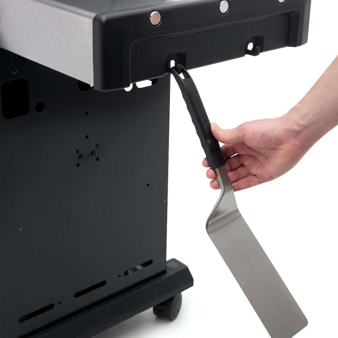 Grill accessory, Broil King, Baron Series, stainless steel spatula hanging from side shelf hook