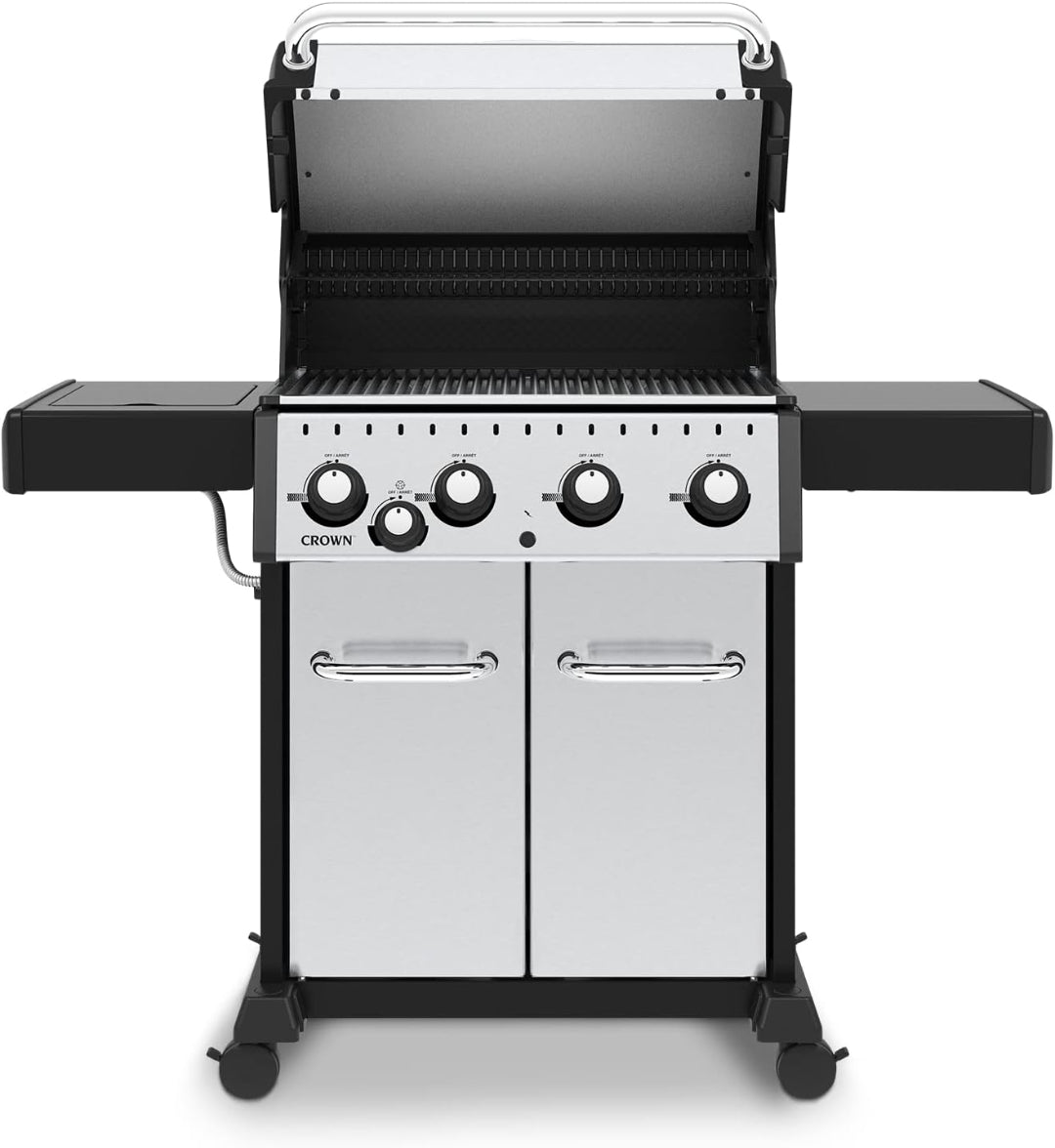 Freestanding gas grill, Broil King Crown Series, stainless steel doors, open lid, 4-burner model on casters