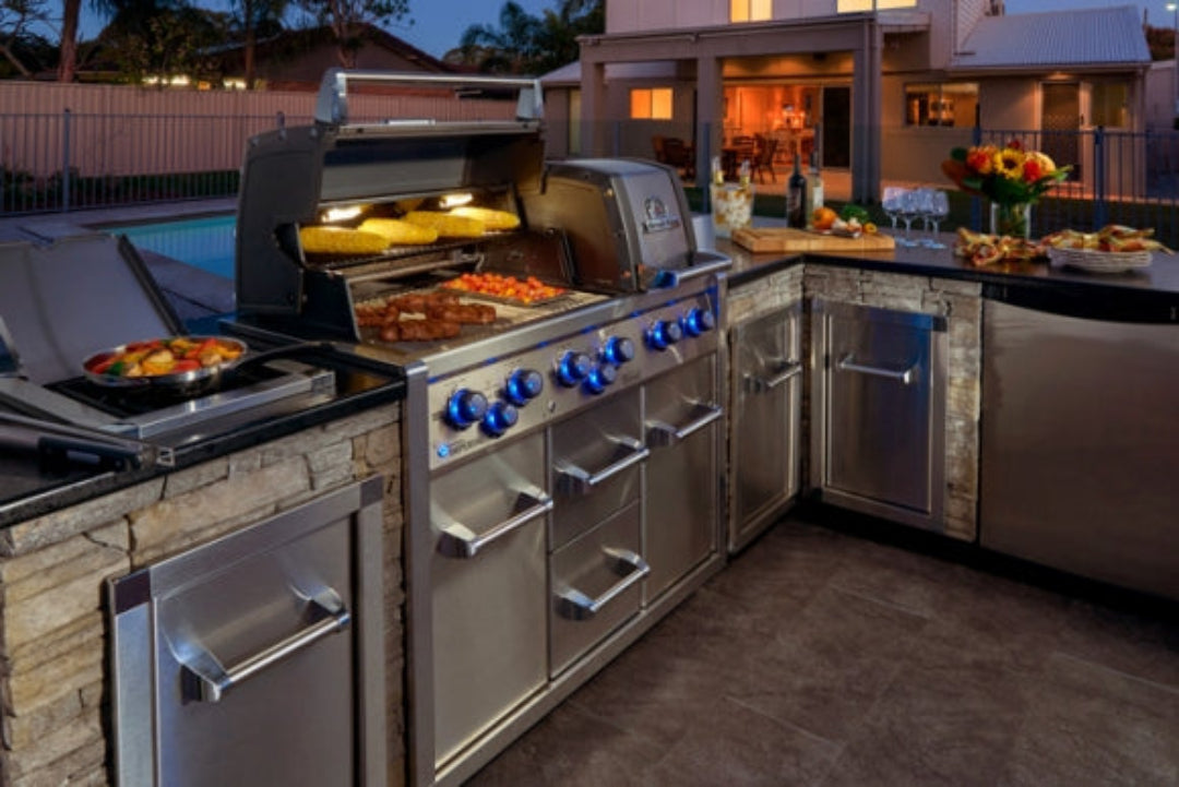 Outdoor kitchen, Broil King, Imperial series, built-in grill with illuminated knobs, side burner, and stainless steel cabinetry.