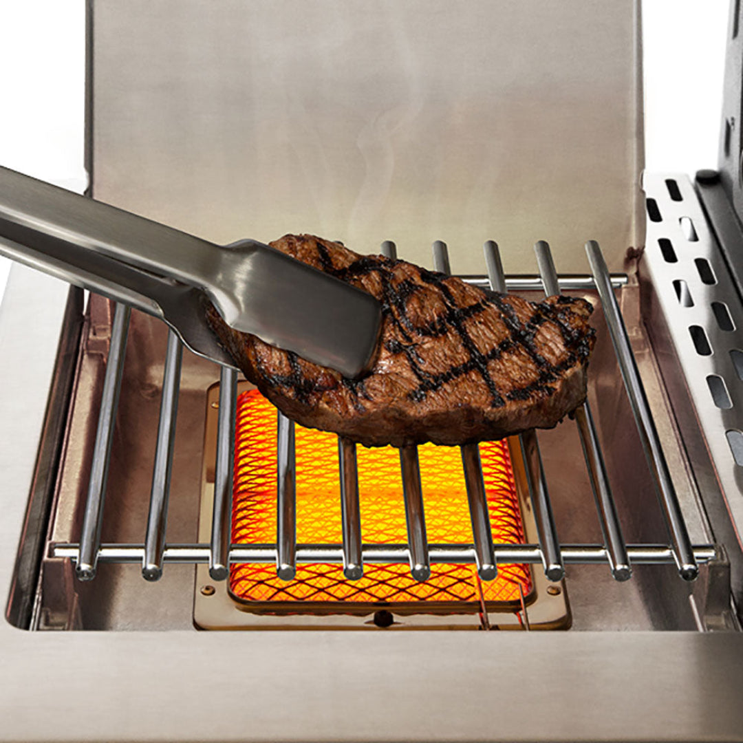 Broil King Regal S 490 Pro infrared sear burner close-up with grilled steak on stainless steel grate, natural gas freestanding grill with iQue precision cooking