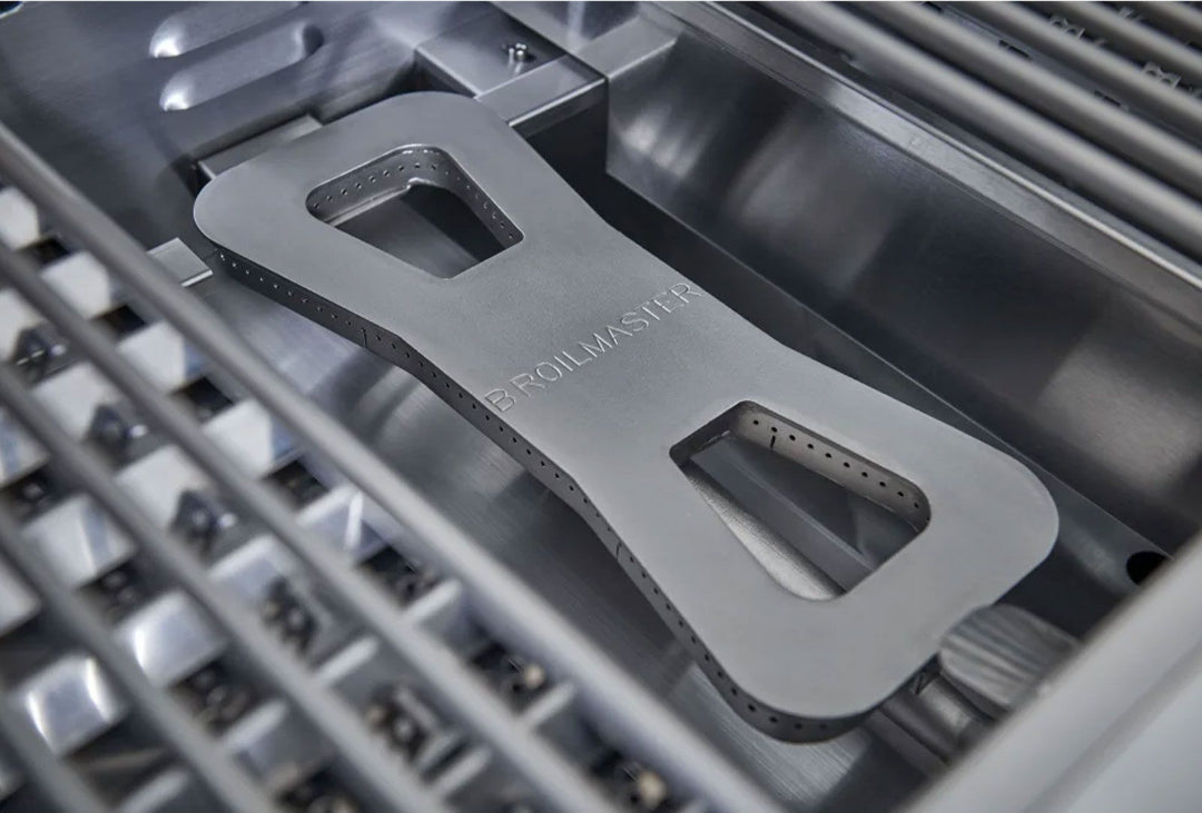 Broilmaster BSG262N 26-inch 2-burner built-in stainless steel natural gas grill burner assembly close-up with embossed BROILMASTER cast stainless burner and cooking grates