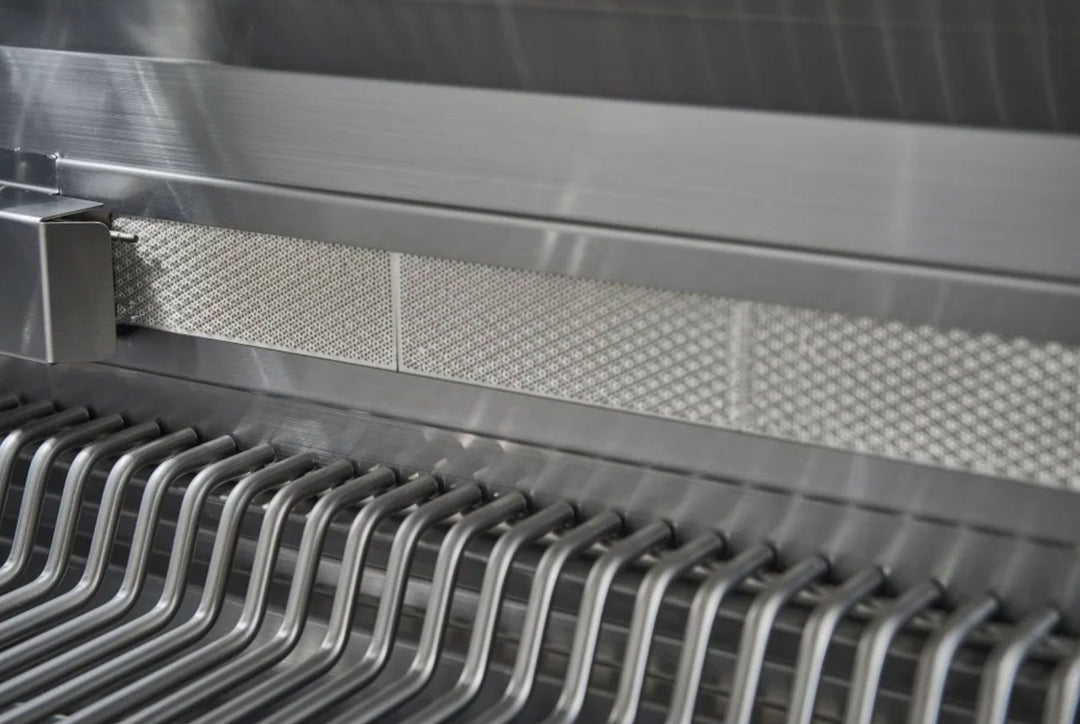 Broilmaster B-Series BSB324P 32-inch 4-burner stainless propane gas grill interior close-up of U-shaped stainless cooking grates and perforated heat diffuser panels