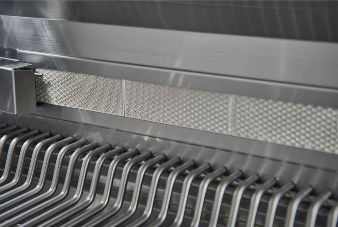 Broilmaster BSB405N B-Series 40-inch 5-burner stainless natural gas grill interior close-up showing stainless steel U-shaped cooking grates and perforated flame tamer heat shield