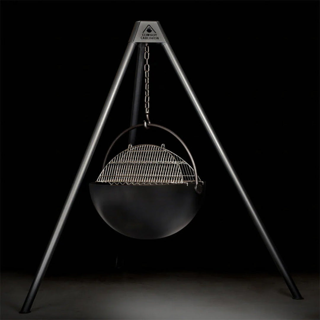 Cowboy Cauldron CC-52001 hanging tripod cauldron grill with black steel fire bowl, adjustable chain and stainless steel cooking grate for outdoor campfire cooking