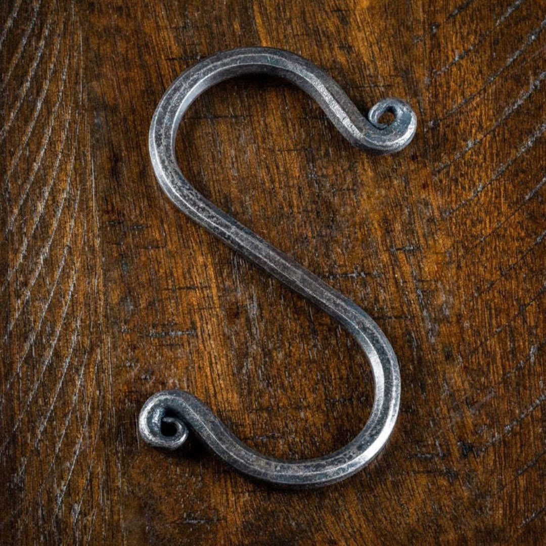 hand-forged wrought iron S-hook CC-90003, rustic blacksmith-made hanging hook with curled scroll ends for pot racks, lanterns, and kitchen or barn hardware