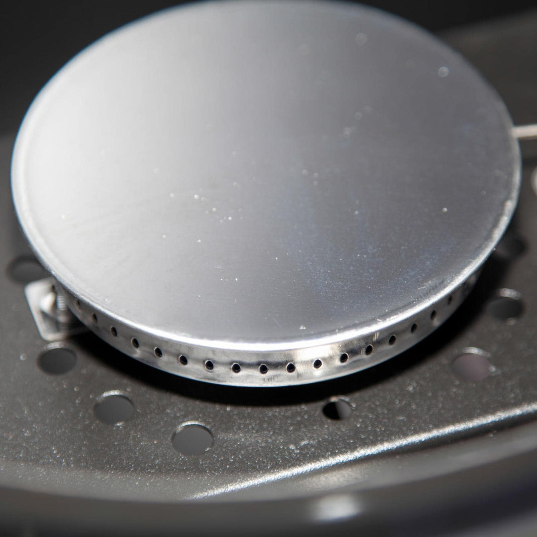 Camp Chef 24-inch replacement stainless steel round burner cap close-up, perforated gas burner head for propane griddle/stove