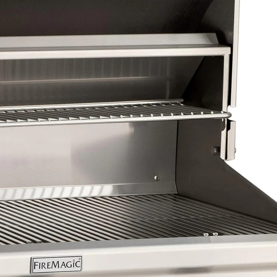 FireMagic Choice Series built-in stainless steel grill interior with heavy-duty primary cooking grates and upper warming rack