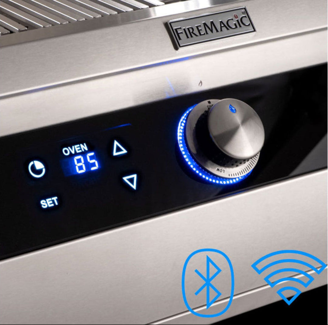 FireMagic E790i built-in stainless steel grill control panel with blue LED digital oven display (85), illuminated rotary temperature knob and Wi‑Fi/Bluetooth smart outdoor kitchen controls