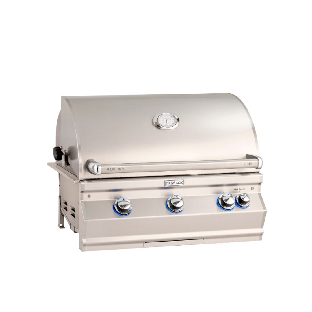Fire Magic Aurora A540i built-in stainless steel gas grill with closed hood, integrated thermometer and blue LED-illuminated control knobs