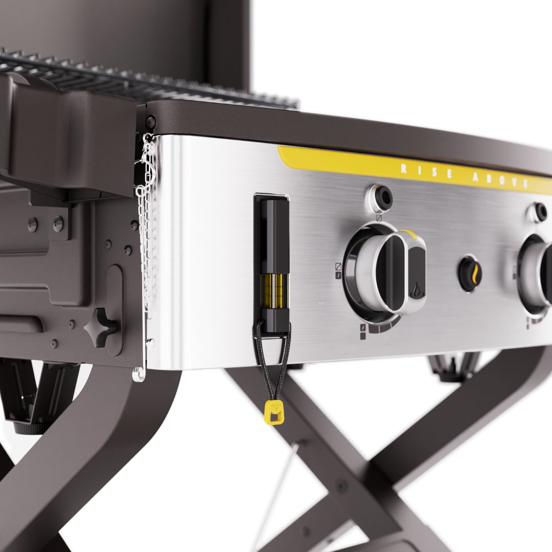 HALO Elite 2B Griddle HZ-1003-XNA close-up of stainless-steel front control panel with two large knobs, integrated vertical bubble level, yellow accent and foldable X-style legs