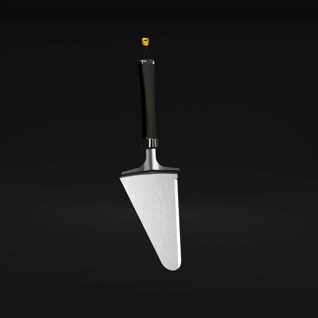 HALO pizza slice server with stainless steel triangular blade, black handle and yellow hanging loop on dark background