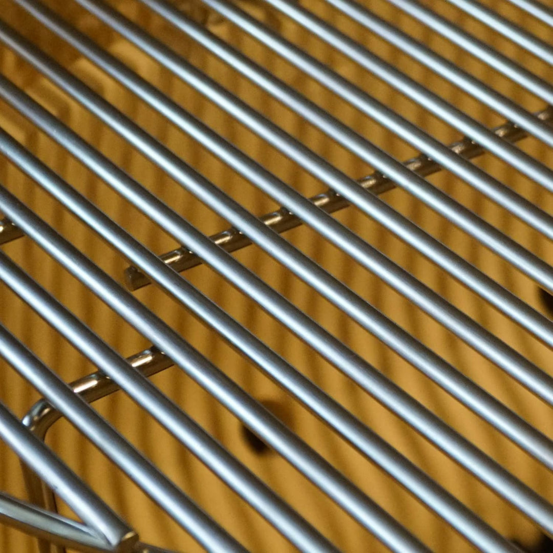 Primo stainless steel replacement cooking grate for Primo XXL oval kamado grill, close-up of heavy-duty round‑rod parallel bars, polished finish