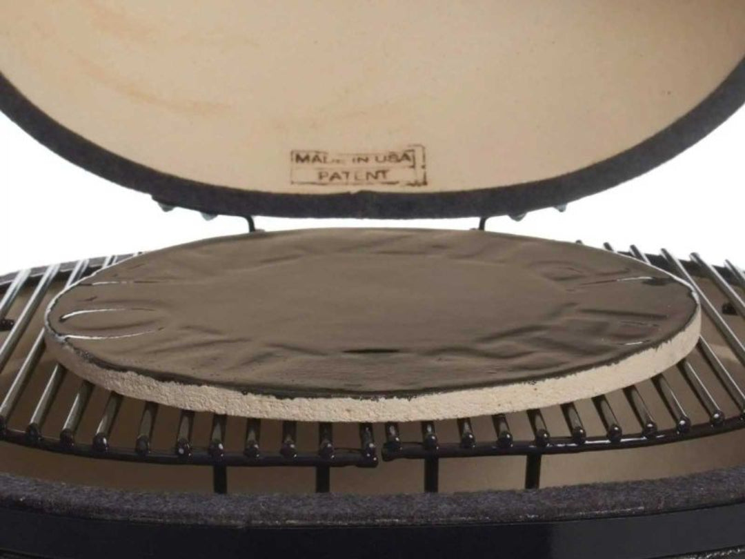 Primo 13-inch glazed ceramic baking stone PG00340 on kamado grill rack, black glazed pizza and bread stone for Primo kamado ovens