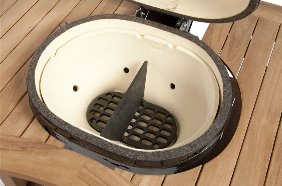 Primo Oval XL 400 cast iron firebox divider and charcoal grate installed inside oval ceramic kamado firebox with lid open