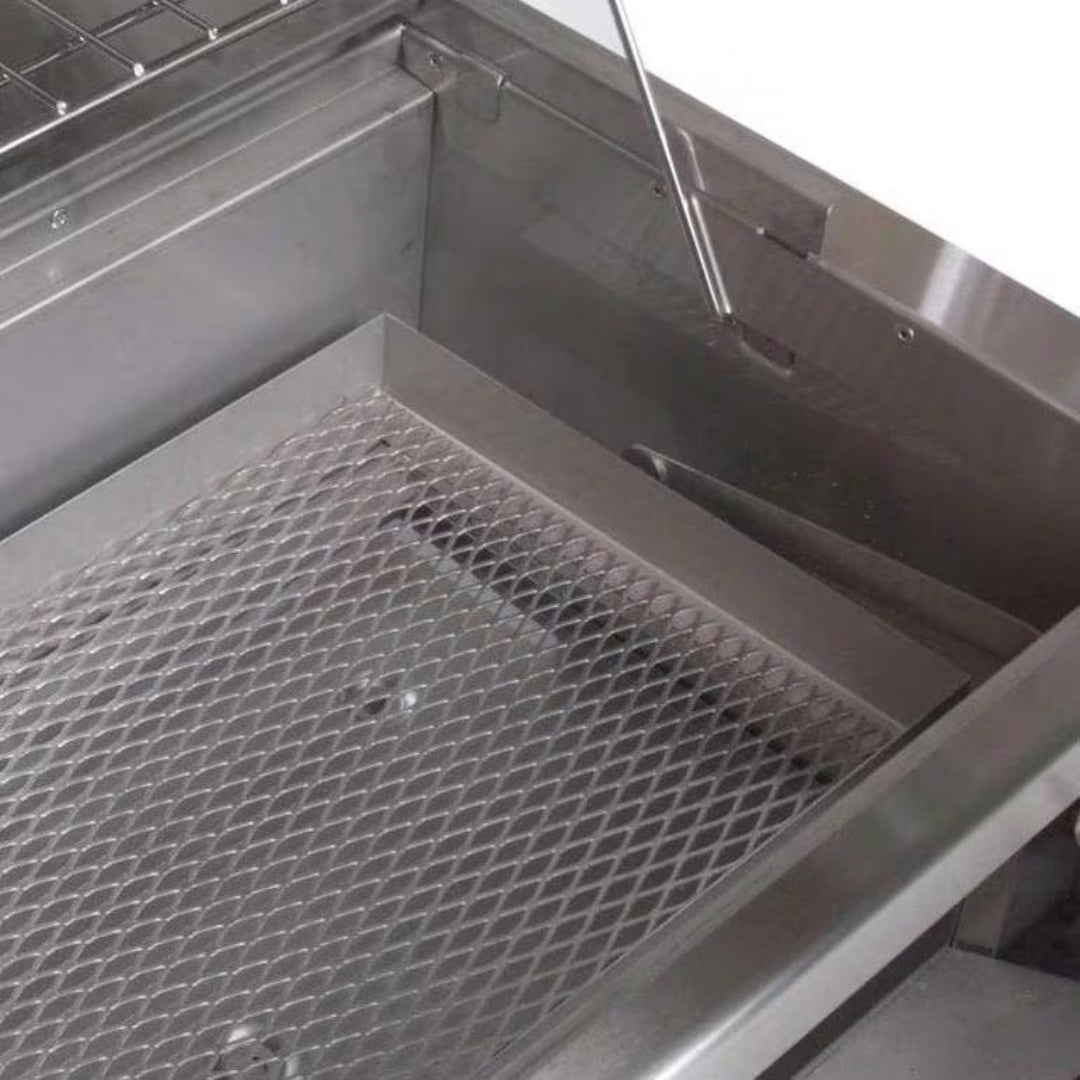 A830i Series stainless steel grill firebox interior with removable expanded-metal ash and charcoal tray and heat deflector for built-in outdoor kitchen