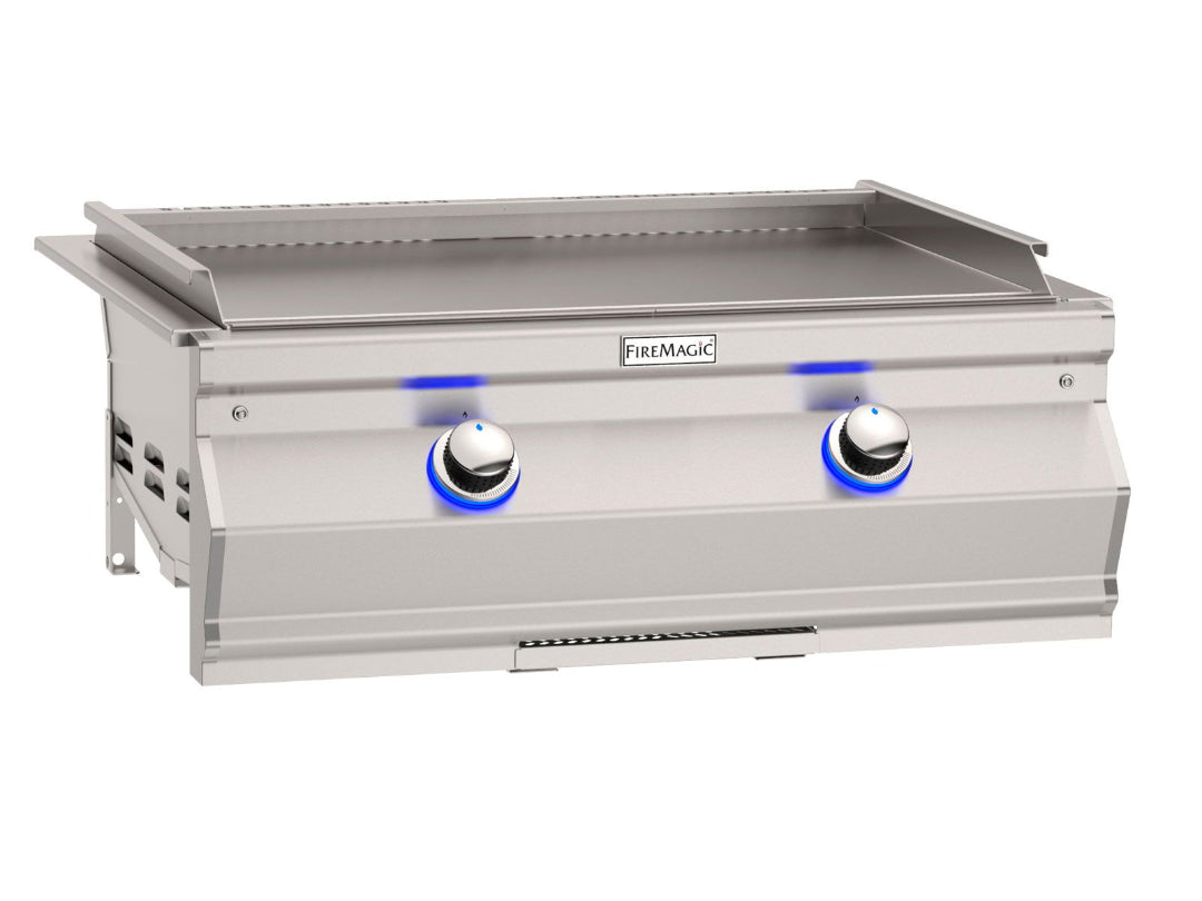 FireMagic Aurora stainless steel built-in outdoor flat-top griddle with two blue LED control knobs, drop-in heavy-duty griddle for outdoor kitchen