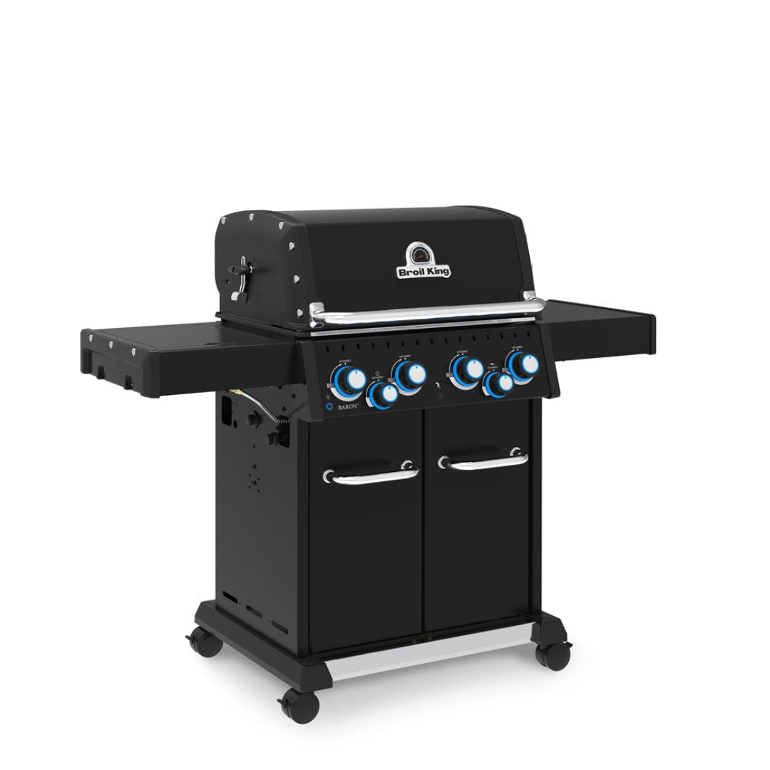 Freestanding grill, Broil King, Baron series, propane gas with four burners and side shelves, angled front-left view