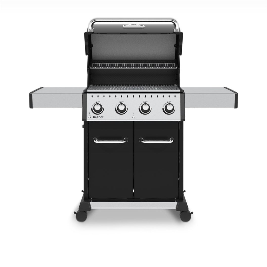 Freestanding gas grill, Broil King, Baron Series, 4-burner model with open hood, stainless steel shelves, and dual-door cabinet