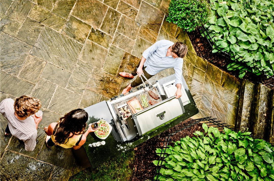 Broil King Imperial S 590i built-in stainless steel gas grill for outdoor kitchen island on stone patio, backyard barbecue with friends - Vine & Flame