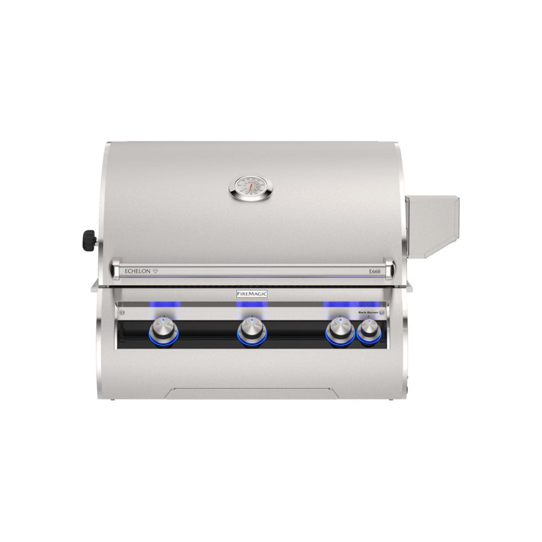 Fire Magic Echelon FM-E660i built-in stainless steel gas grill head with analog lid thermometer and blue LED illuminated control knobs, front view