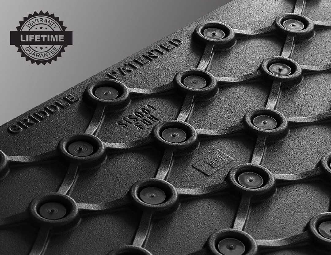 Le Griddle cast iron griddle underside with patented support-ring grid, textured finish and lifetime warranty badge