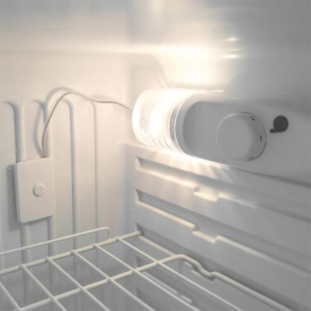 Stick-on battery-powered LED interior light for wine fridge or refrigerator — cylindrical lamp with inline on/off switch and adhesive battery pack mounted near thermostat