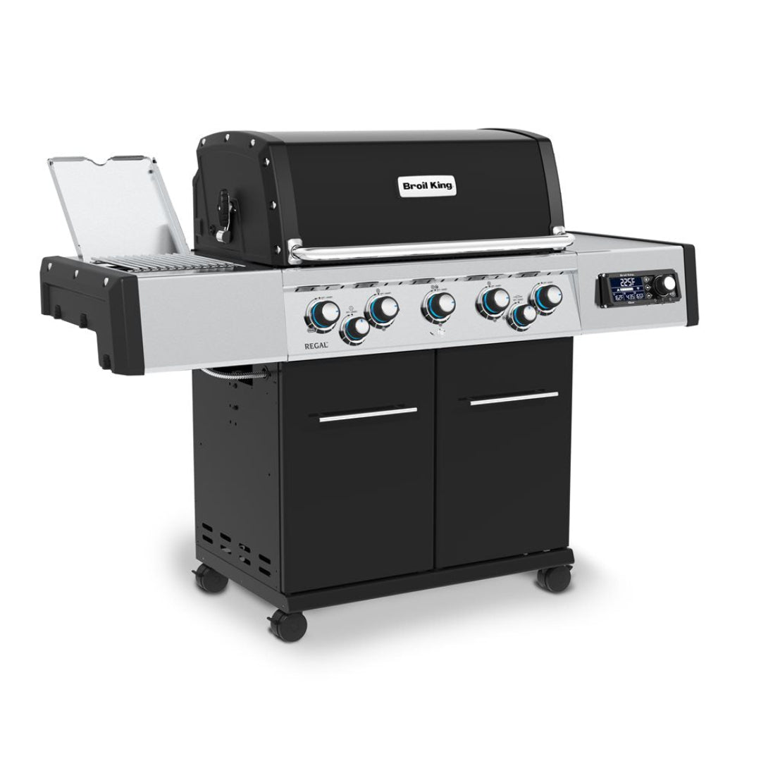 Broil King Regal Q 590 Pro IR gas grill — stainless steel control panel with blue-backlit knobs, digital temperature display, flip-up side burner, infrared sear and enclosed cart with caster wheels