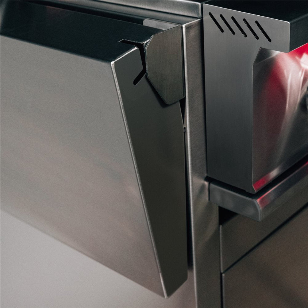 Trueflame CART-TF-32DC stainless steel outdoor kitchen cart close-up showing heavy-duty drawer hinge, corner bracket and brushed stainless drawer front