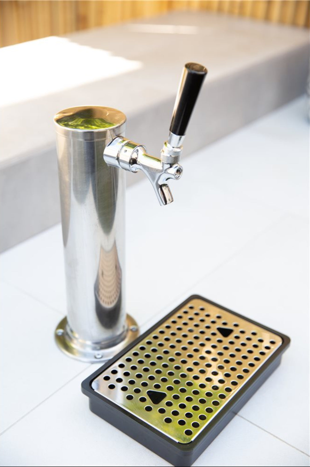 Stainless steel single-tap draft beer tower with chrome faucet and black handle, perforated drip tray for kegerator home bar