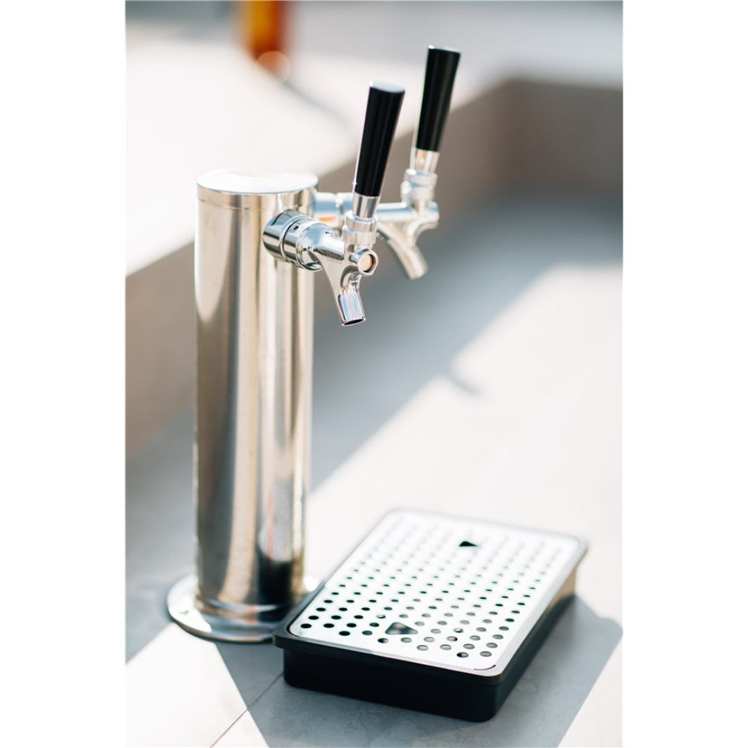 Stainless steel dual-faucet beer tower with black tap handles and drip tray for home kegerator draft beer dispenser