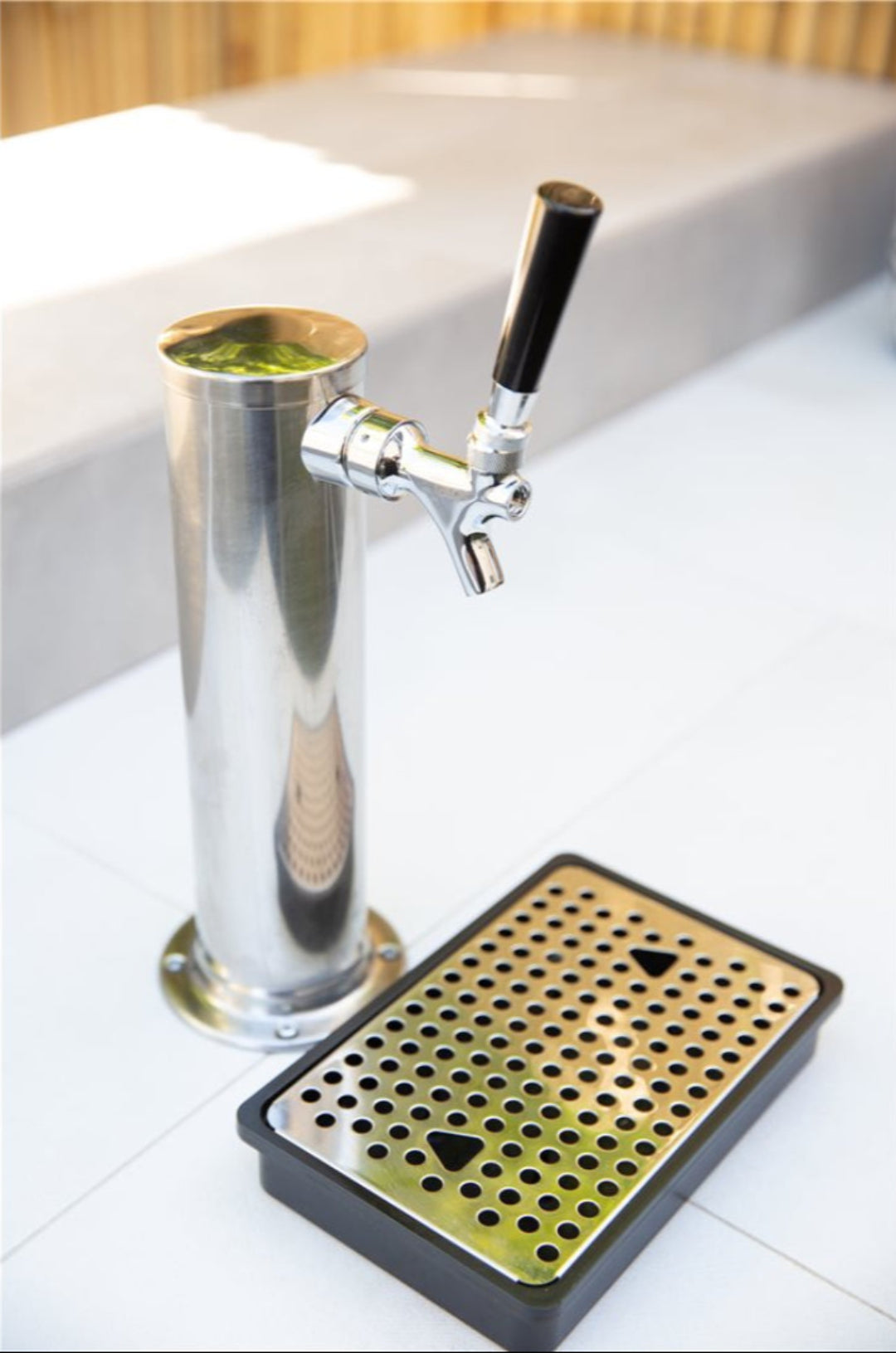 Single stainless steel draft tower with chrome beer faucet and black tap handle, perforated stainless drip tray for kegerator
