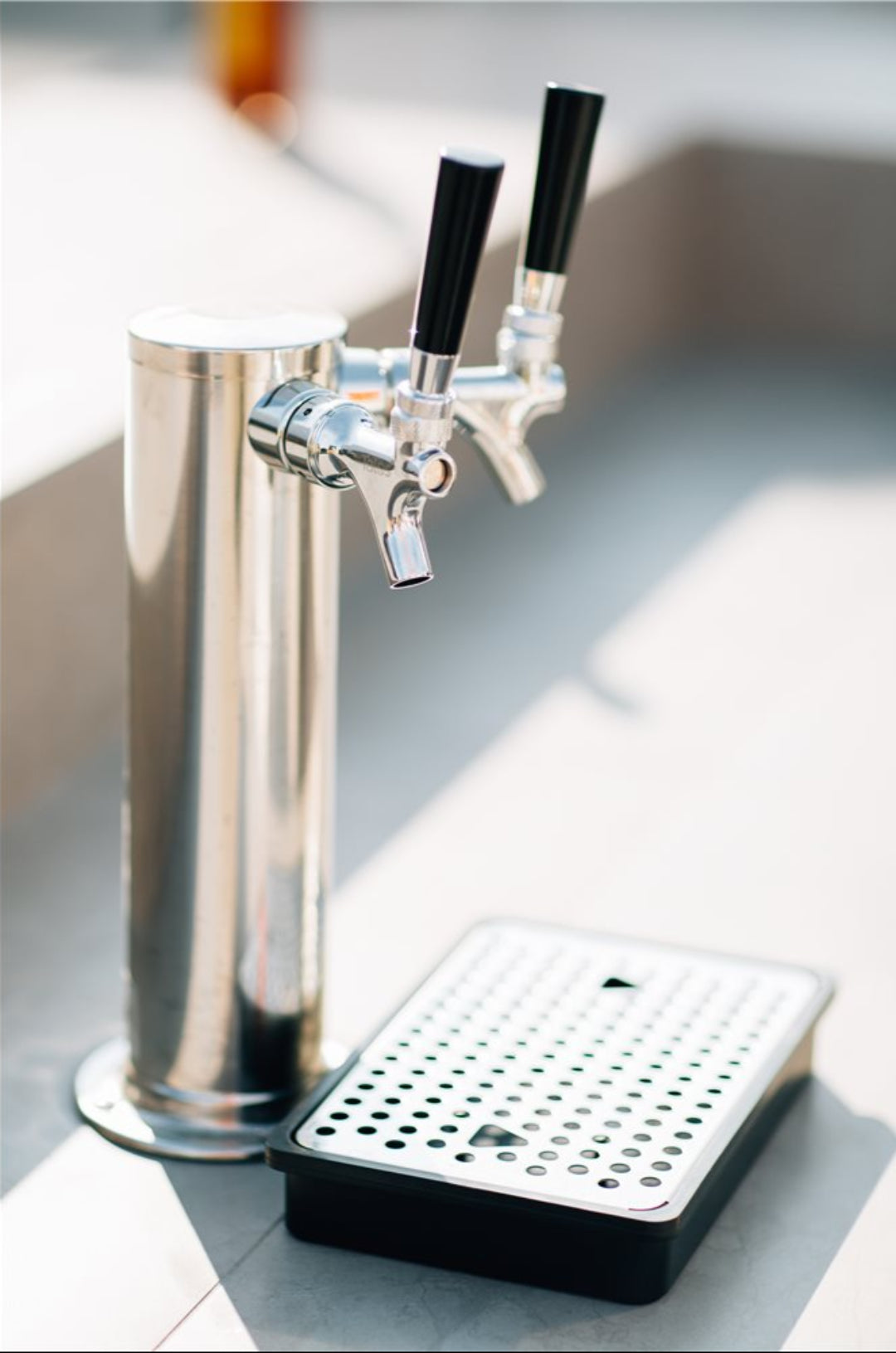 Vine & Flame stainless steel dual-faucet draft beer tower with black tap handles and removable perforated drip tray for home kegerator