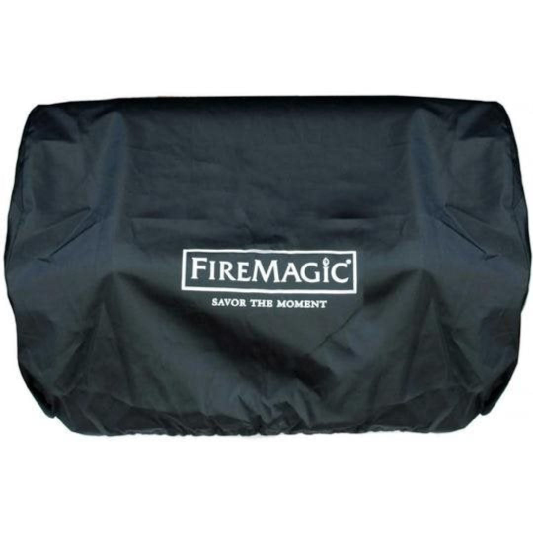 FireMagic black vinyl outdoor grill cover with elastic hem and white 'Savor the Moment' logo