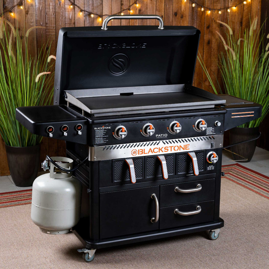 Blackstone 36-inch Patio Collection 4-burner propane flat-top griddle with air fryer combo on cart with side shelves, storage drawers and caster wheels