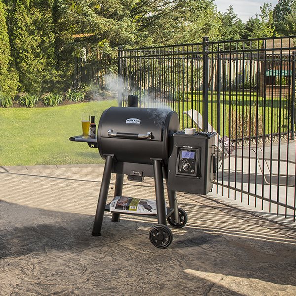 Pellet Grill, Broil King, Regal Pellet 400 Series, outdoor patio smoking with accessories on side shelf