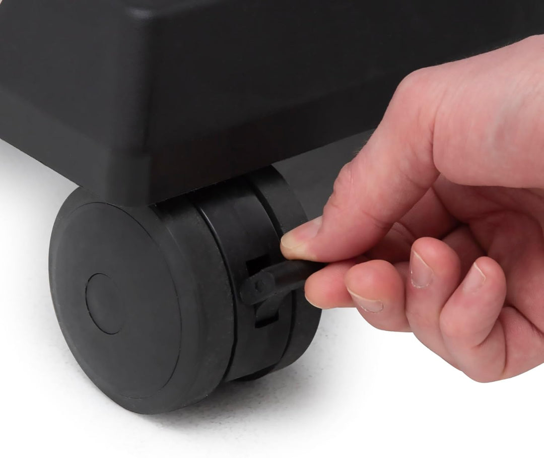 Caster Wheel – Broil King – Crown Series – Close-Up of Wheel Lock Being Engaged by Hand on Grill Base