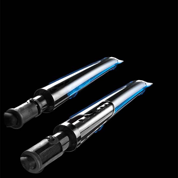 Main Burners – Broil King – Crown Series – Triple Tube Burner Design – Lit with Blue Flame – Isolated on Black Background – High-Efficiency Flame Pattern